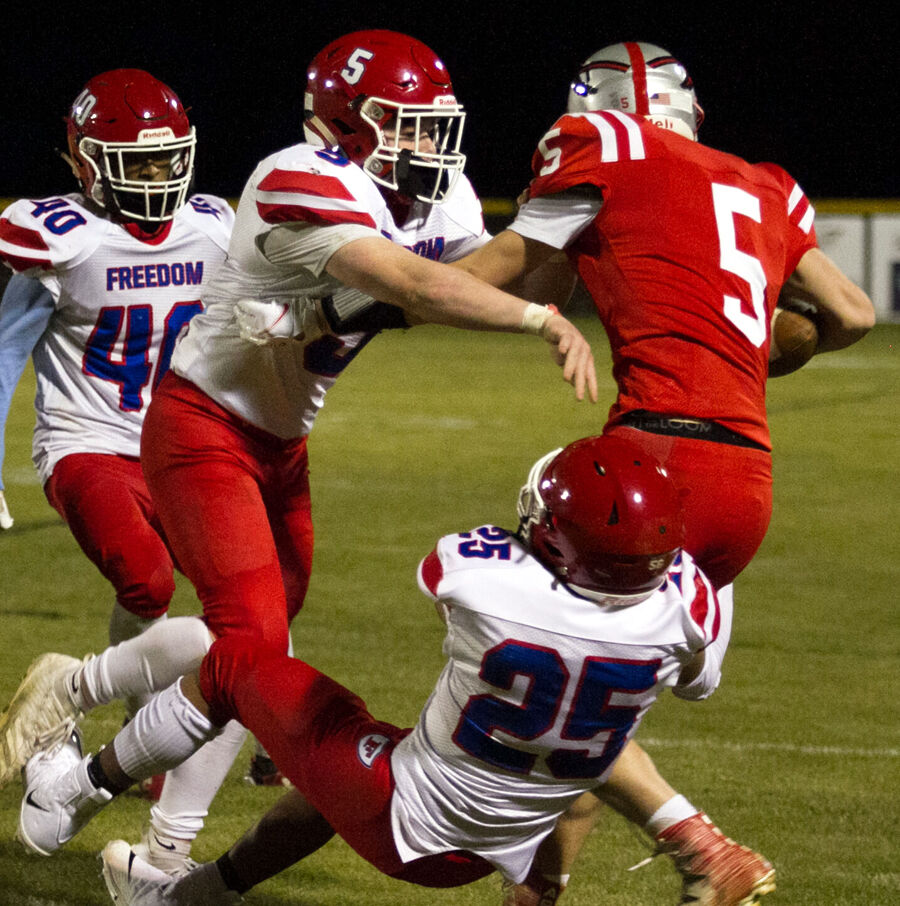 030321-mnh-sports-hs-football-defenses-p3jump
